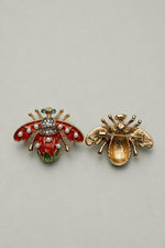 Broche de Metal — frente e verso